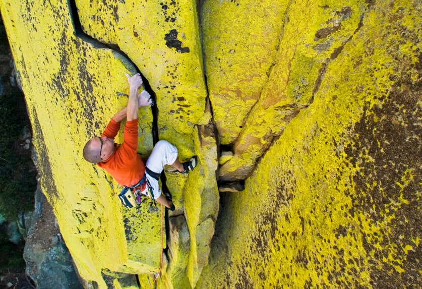 A man scaling a rock face 