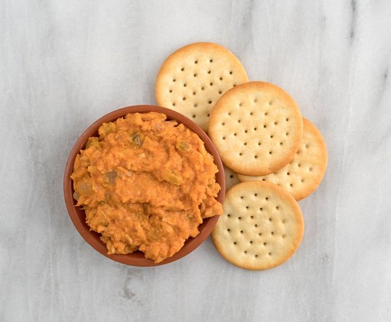 bowl of curried tuna salad with butter crackers