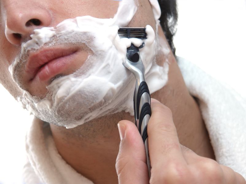 close up of man shaving