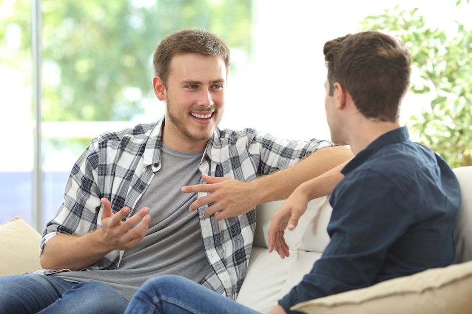 Two friends talking at home