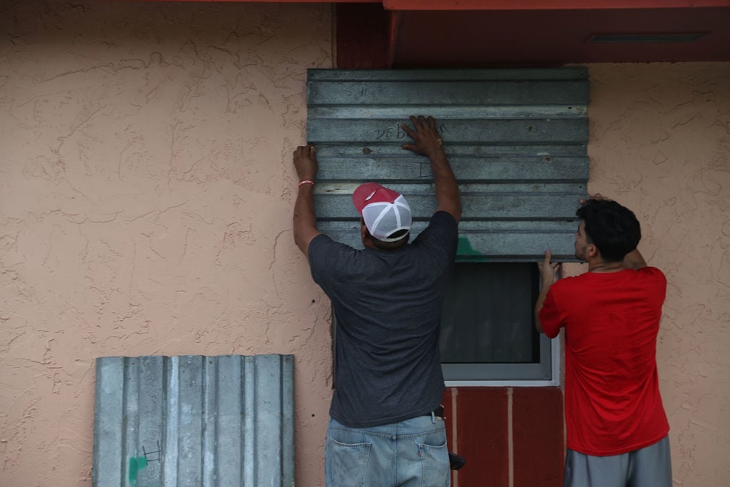 Residents board up their windows