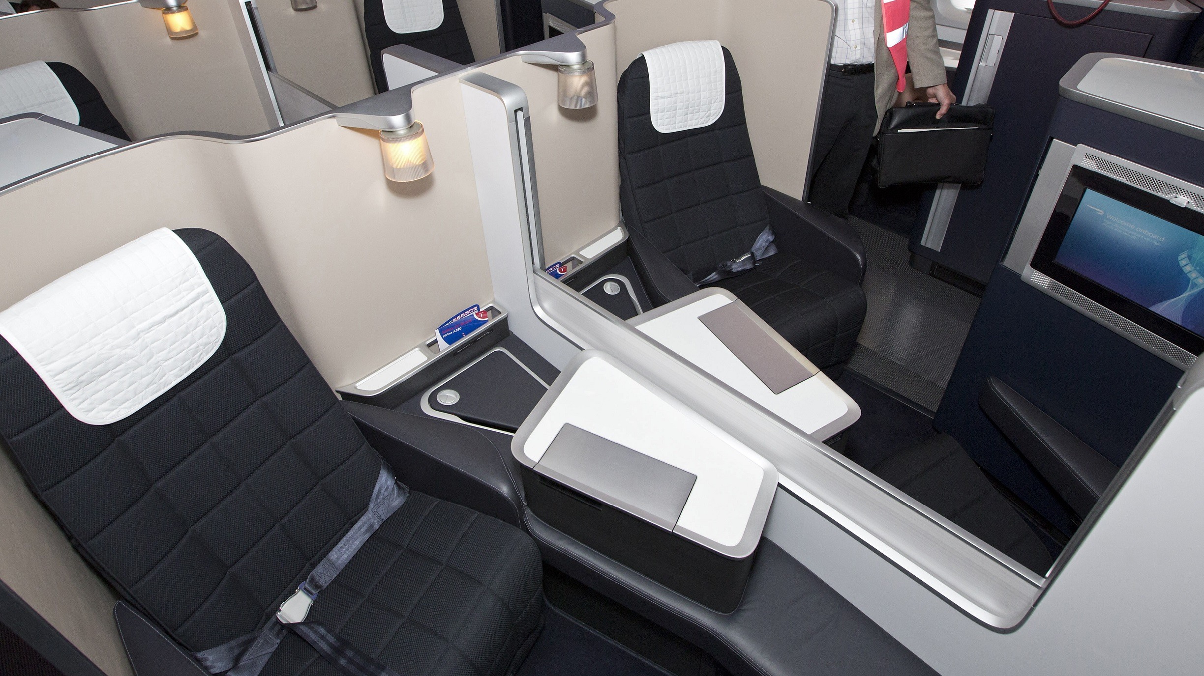 Members of the media look around the first class section of a British Airways Airbus A380