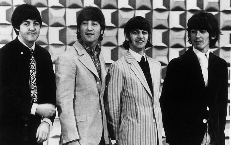 Which Beatles Played the Rocking Lead Guitars on 'And Your Bird Can Sing'?