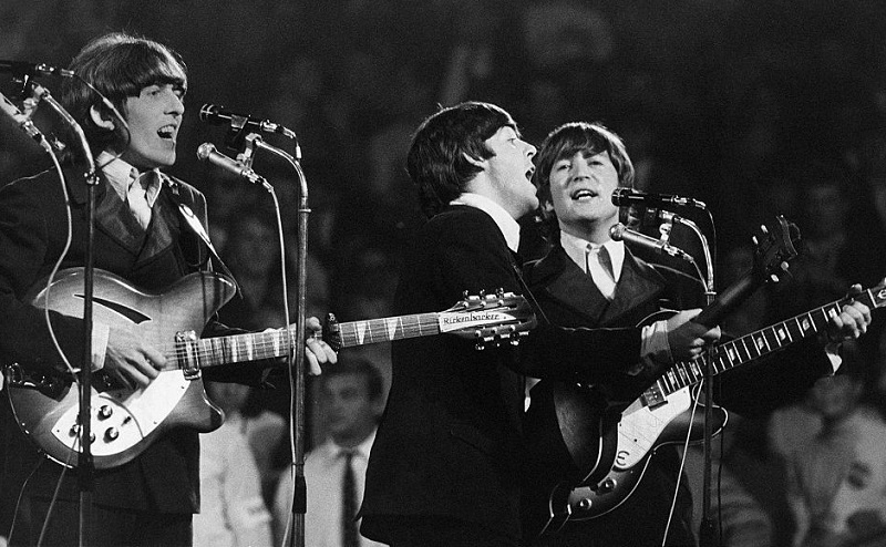 Which Beatles Played the Rocking Lead Guitars on 'And Your Bird Can Sing'?