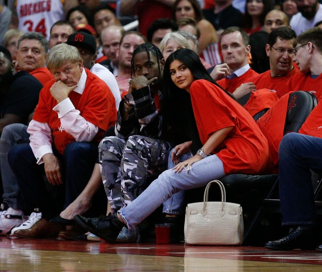 Travis Scott and Kylie Jenner at a basketball game