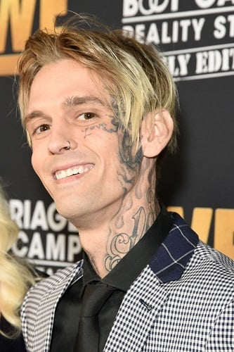 Aaron Carter looks unrecognizable with shaved head and MORE tattoos after  singers split from fiancée Melanie Martin  The US Sun