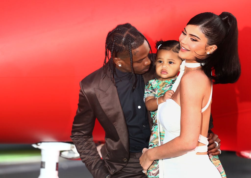 Travis Scott, Stormi Webster, and Kylie Jenner on the red carpet in August 2019