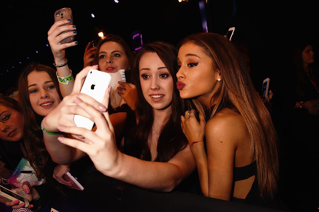 Ariana Grande takes a selfie with a fan as she attends the MTV EMA's 2014 on November 9, 2014 in Glasgow, Scotland. 
