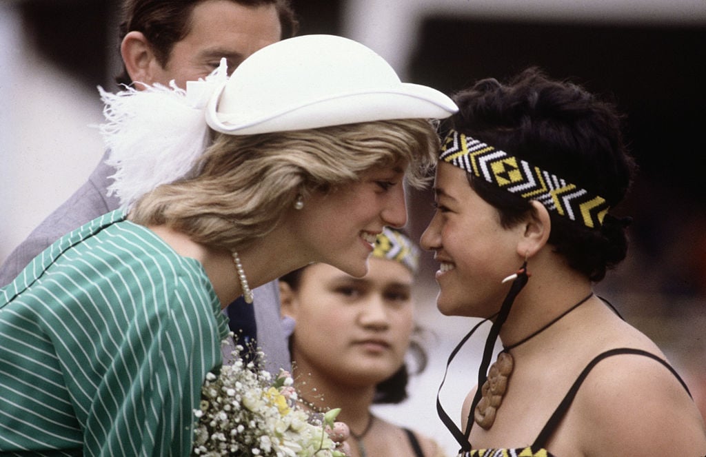 Princess Diana is greeted with the traditional greeting of a nose rub upon her arrival in Auckland, New Zealand