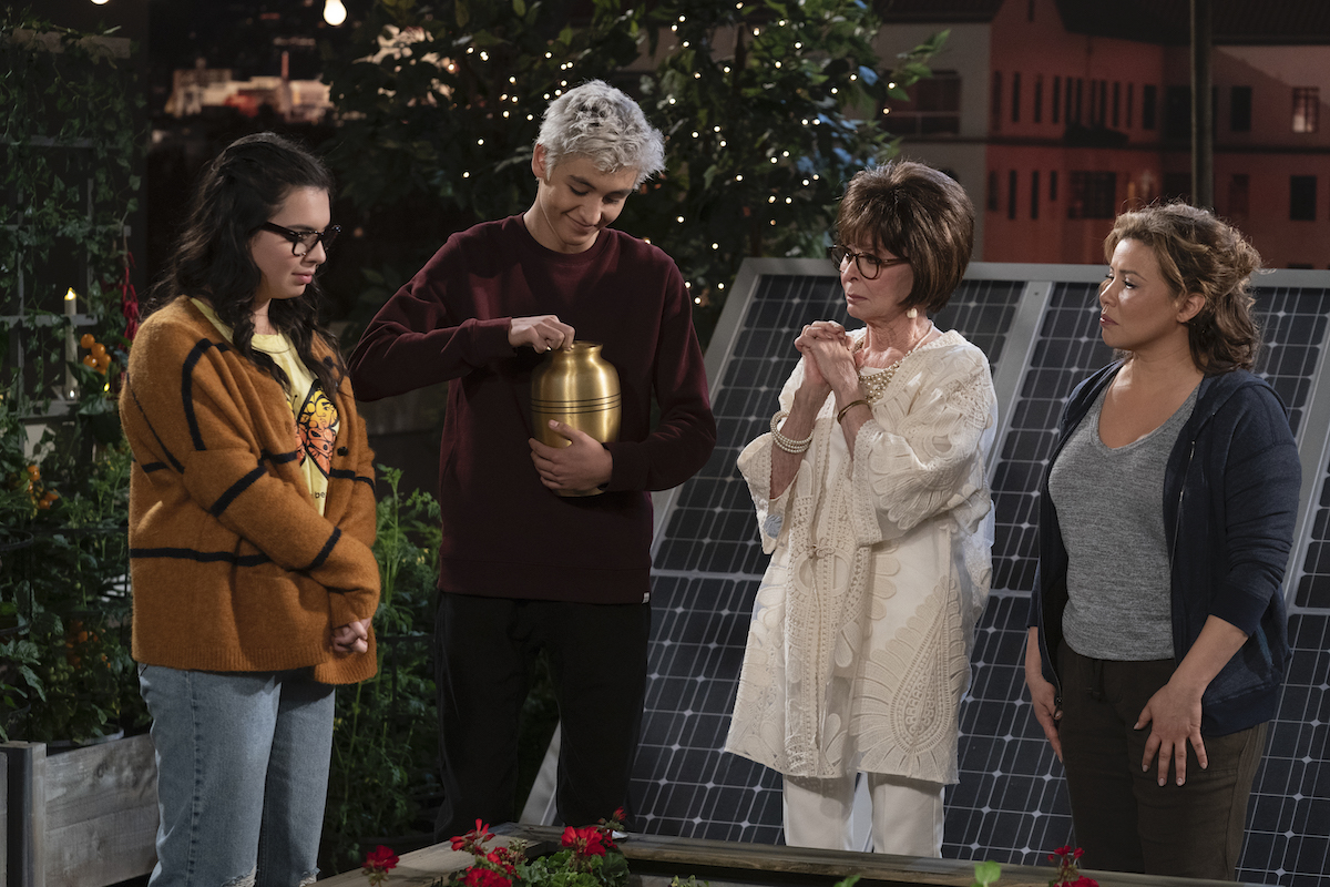 The Alvarez family spreads Berto Riera's ashes in his garden. 