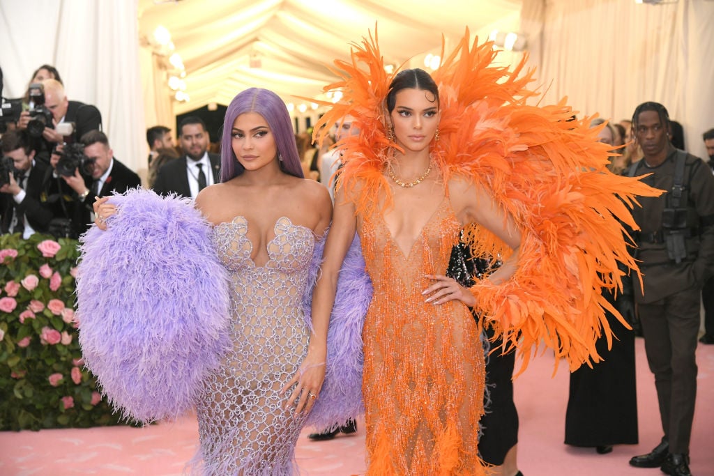 Kylie Jenner in purple and Kendall Jenner in orange on the red carpet