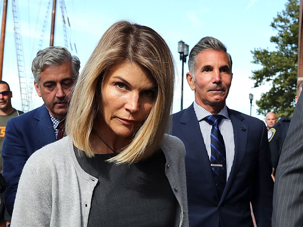 Lori Loughlin and her husband Mossimo Giannulli, right, leave the John Joseph Moakley United States Courthouse