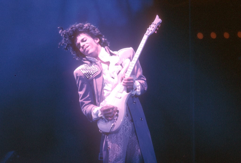 Prince playing the guitar