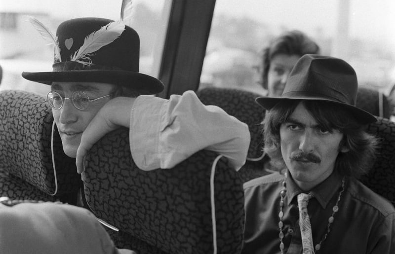 Beatles Lennon and Harrison on a bus