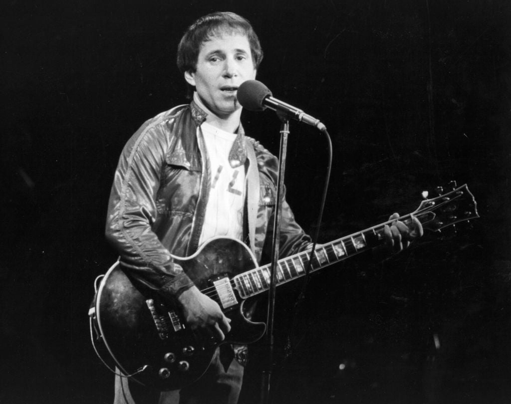 Paul Simon with a guitar