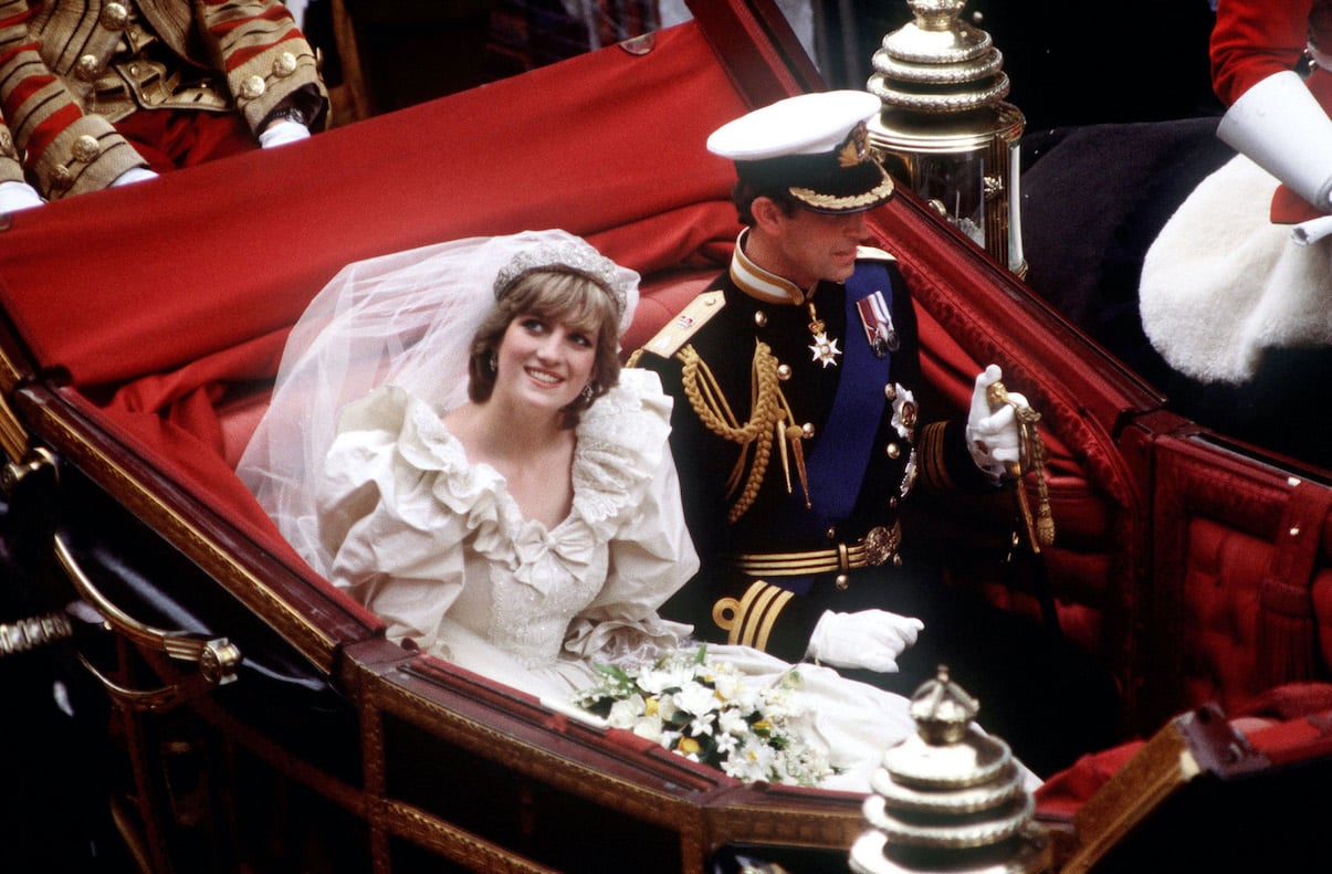Princess Diana and Prince Charles ride in a carriage after their 1981 royal wedding ceremony