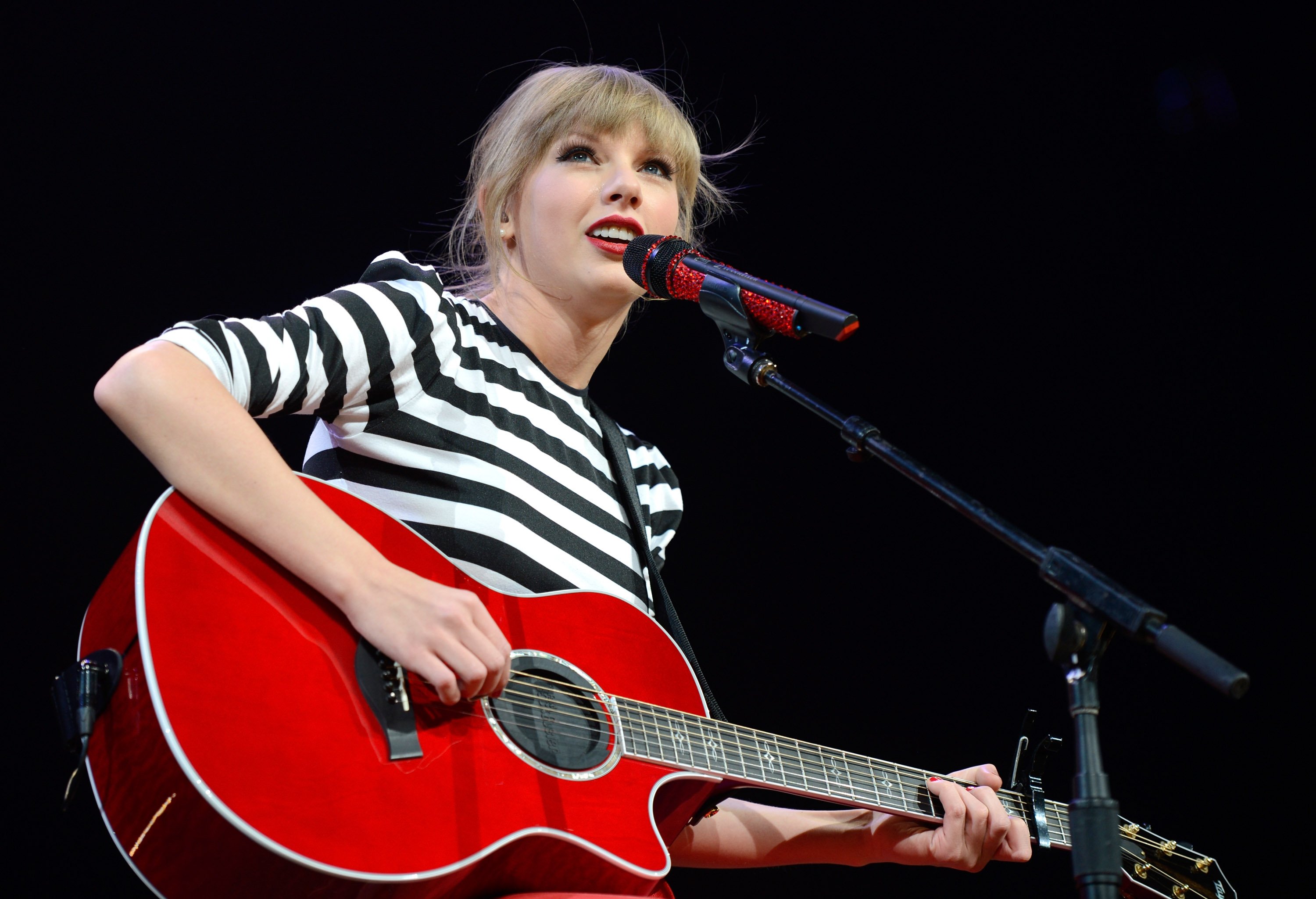 Taylor Swift performs on stage during The RED Tour on March 27, 2013, in Newark, New Jersey.