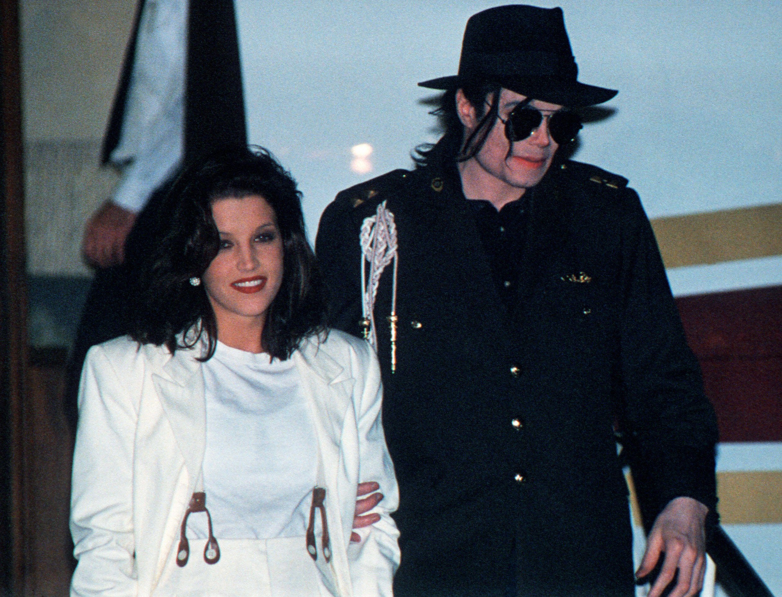 This August 16, 1994 file photo shows US pop star Michael Jackson and his then wife Lisa-Marie Presley arriving at the airport in Budapest.