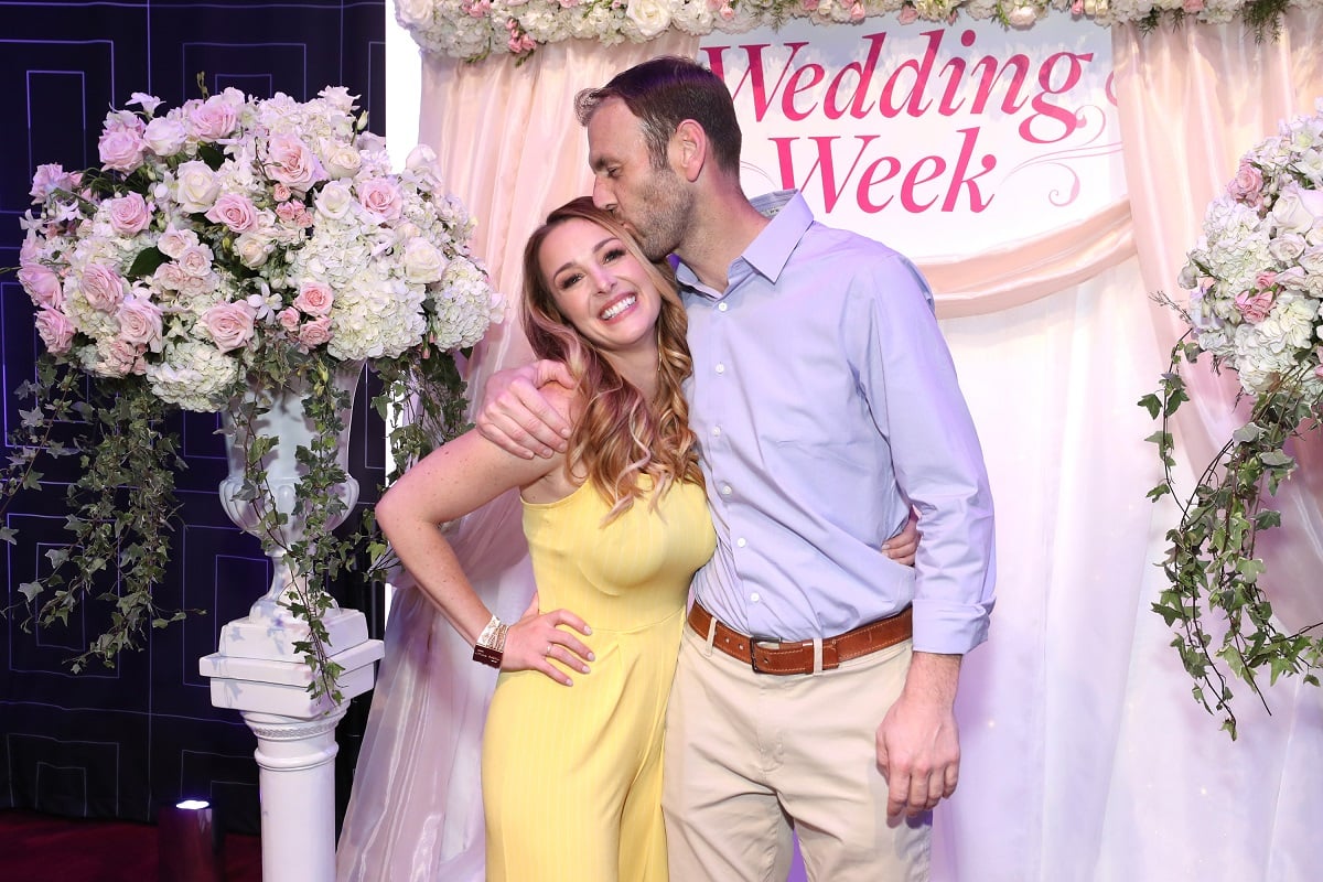 Jamie Otis and Doug Hehner of 'Married at First Sight' kissing at an A+E Wedding Week event