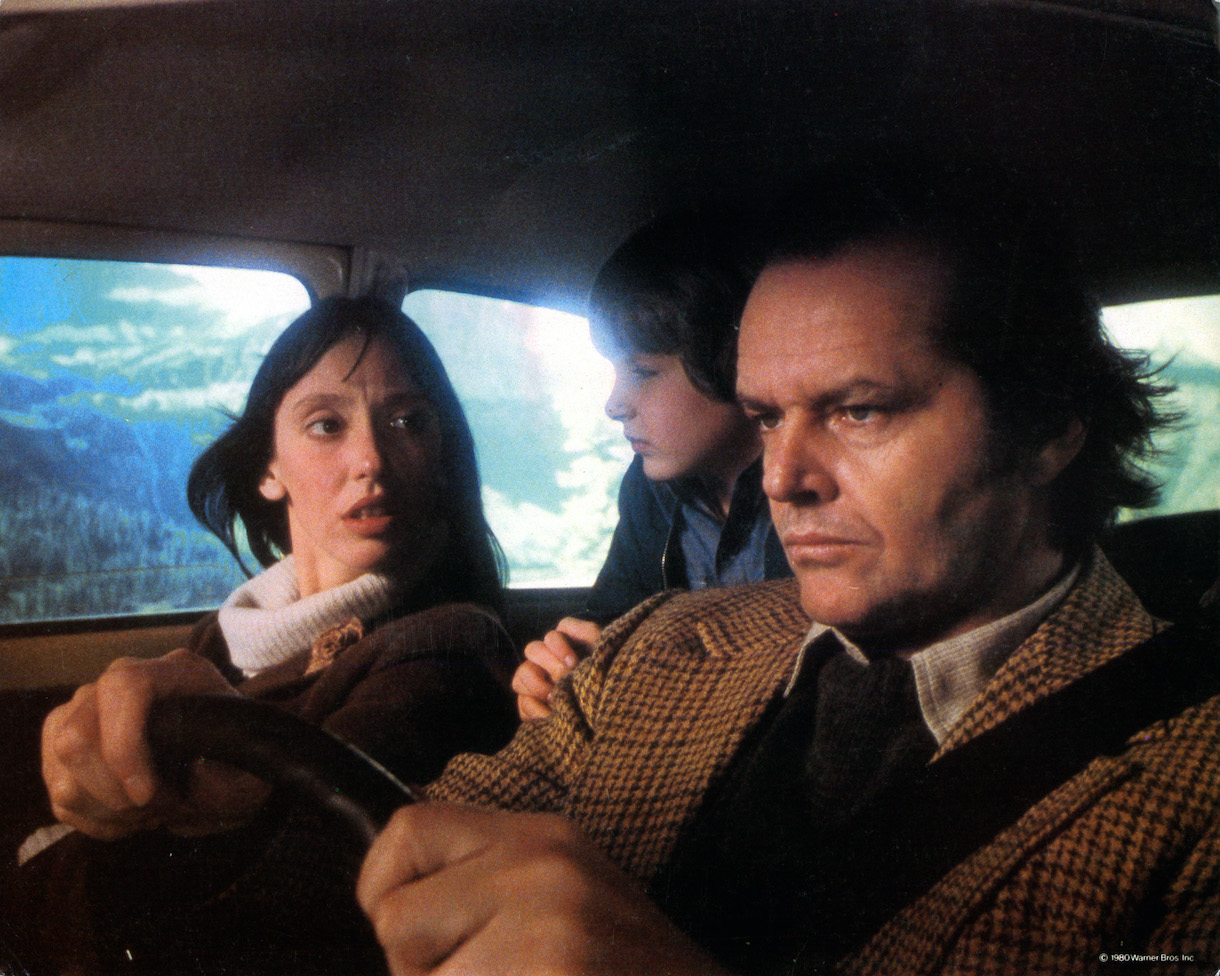 Shelley Duvall, Danny Lloyd, and Jack Nicholson in car on their way to resort in lobby card for the film 'The Shining', 1980