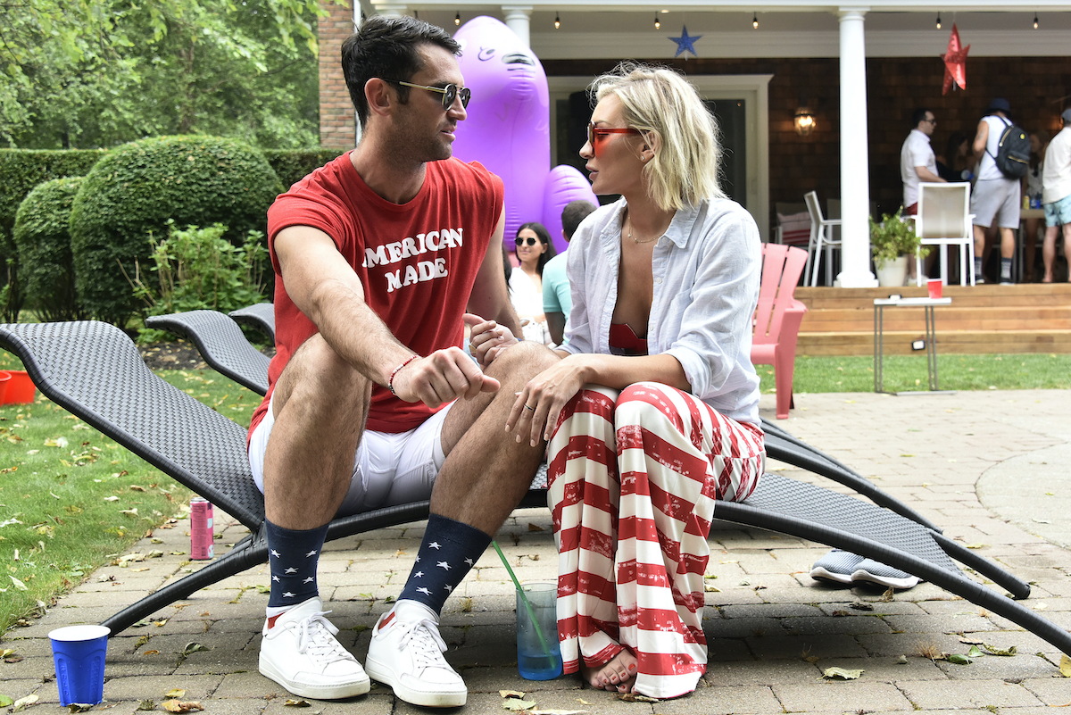 Carl Radke, Lindsay Hubbard from 'Summer House' talk during a party