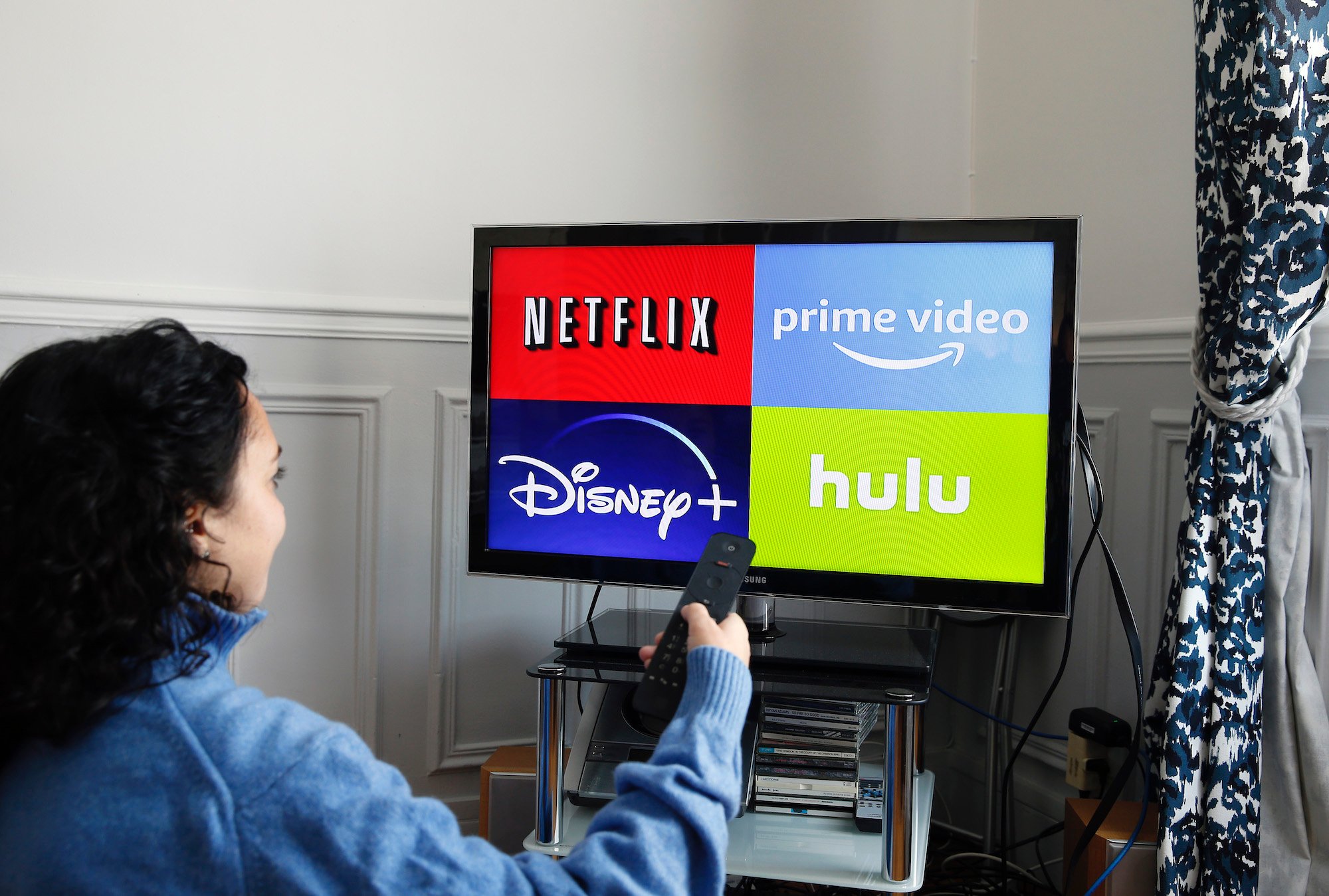 Disney+, Netflix, Hulu, and Amazon Prime logo on a TV