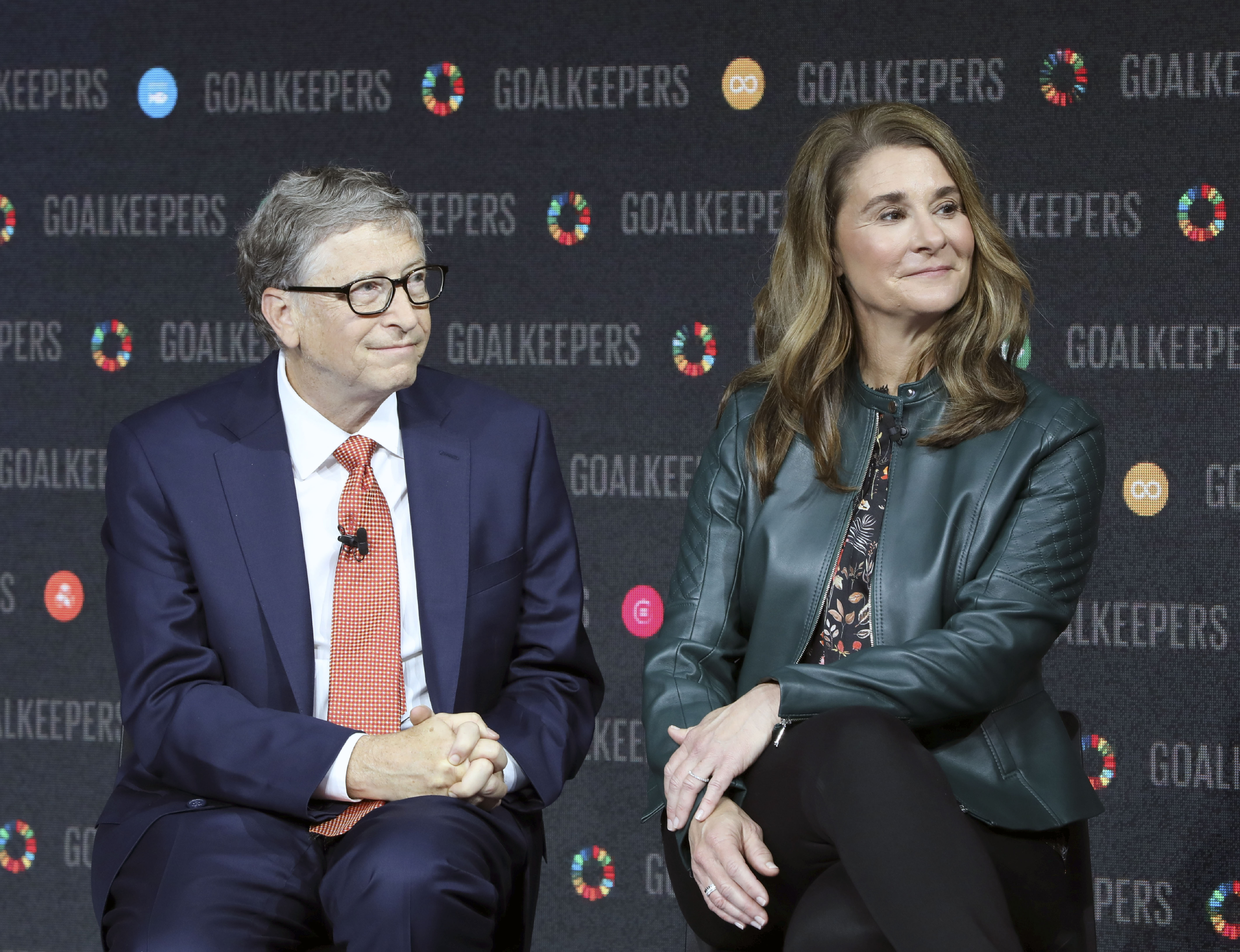Bill Gates in a suit and Melinda Gates in a green jacket and black pants at Goalkeepers event in NYC