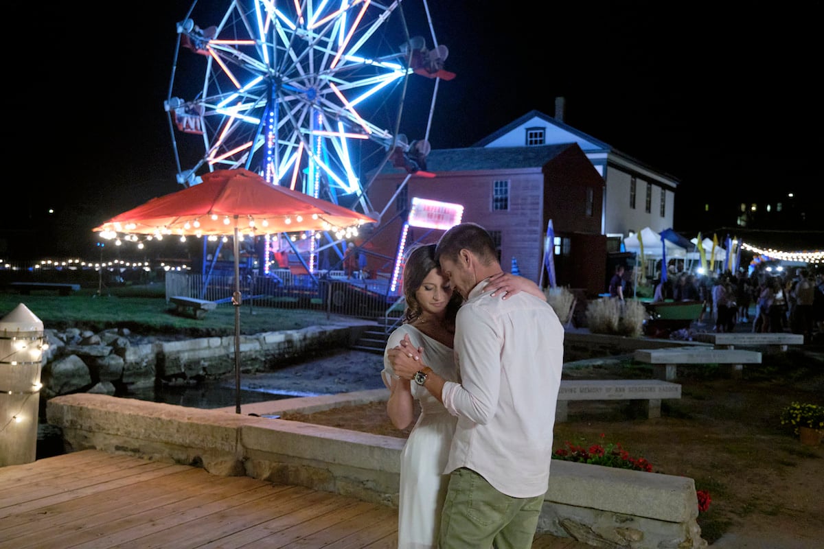 Aly Michalka and Chad Michael Murray dancing in front of a Ferris wheel in Sand Dollar Cove