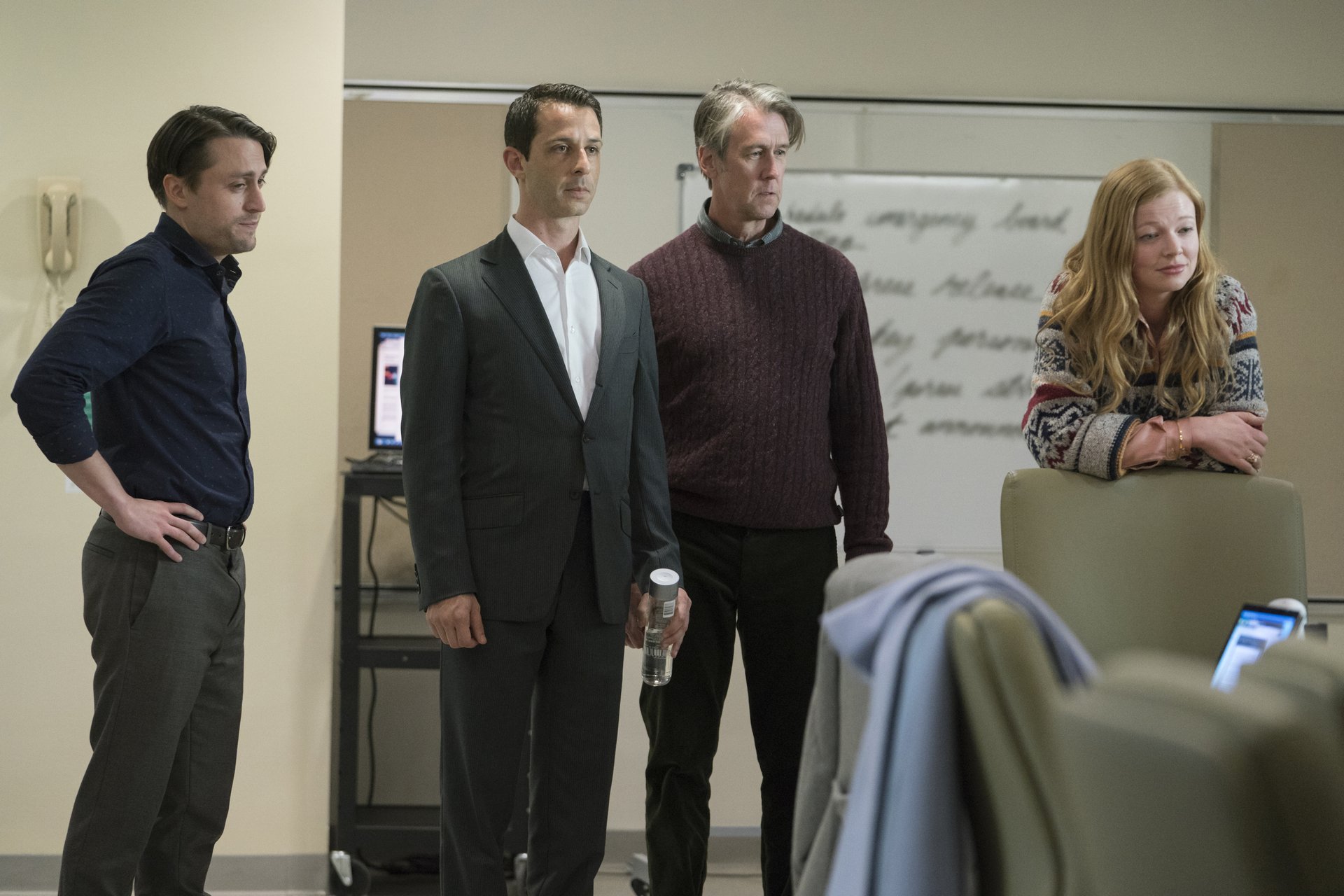 Kieran Culkin, Sarah Snook, Jeremy Strong, and Alan Ruck stand in a hospital room in 'Succession.'