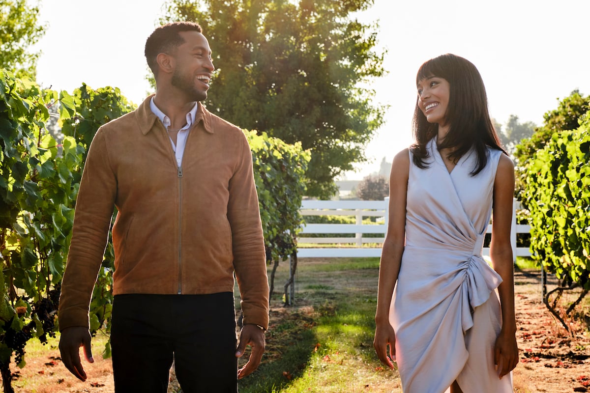 Brooks Darnell and Erinn Westbrook walking in a vineyard in 'Advice to Love By'