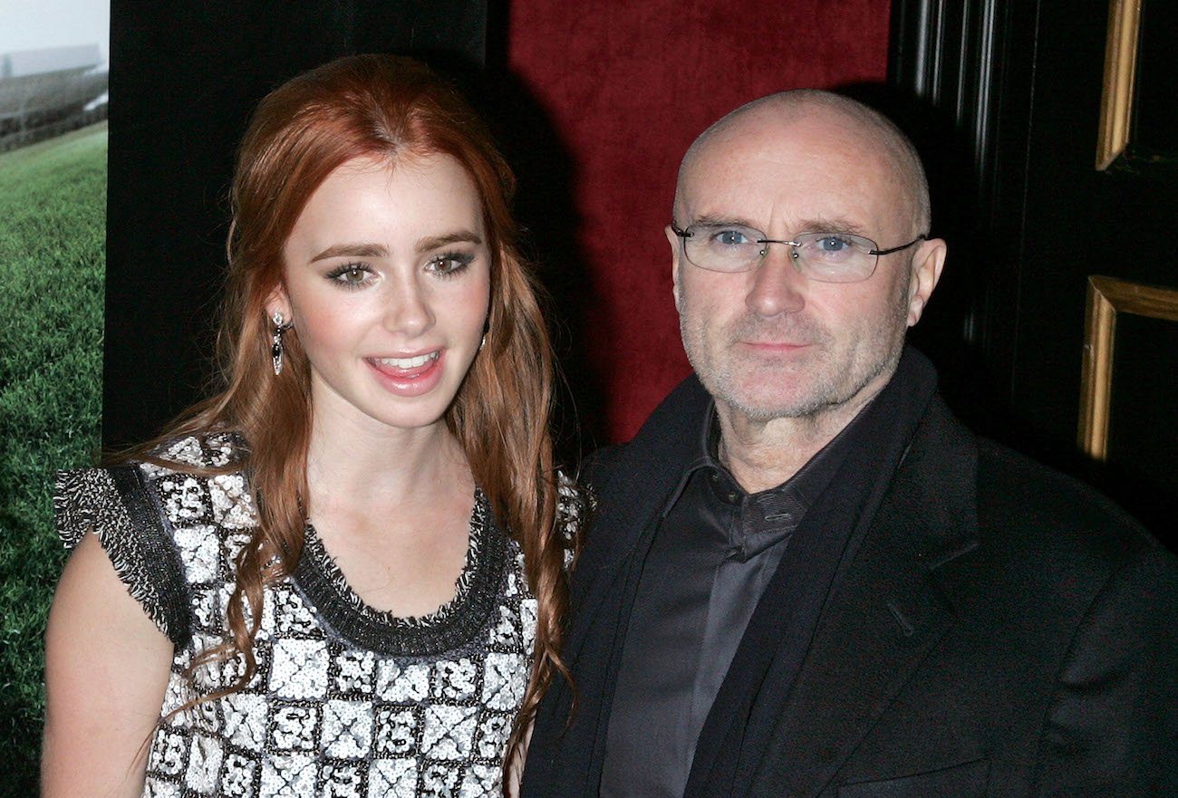 Lily Collins with her father Phil Collins at the premiere of 'The Blind Side.'