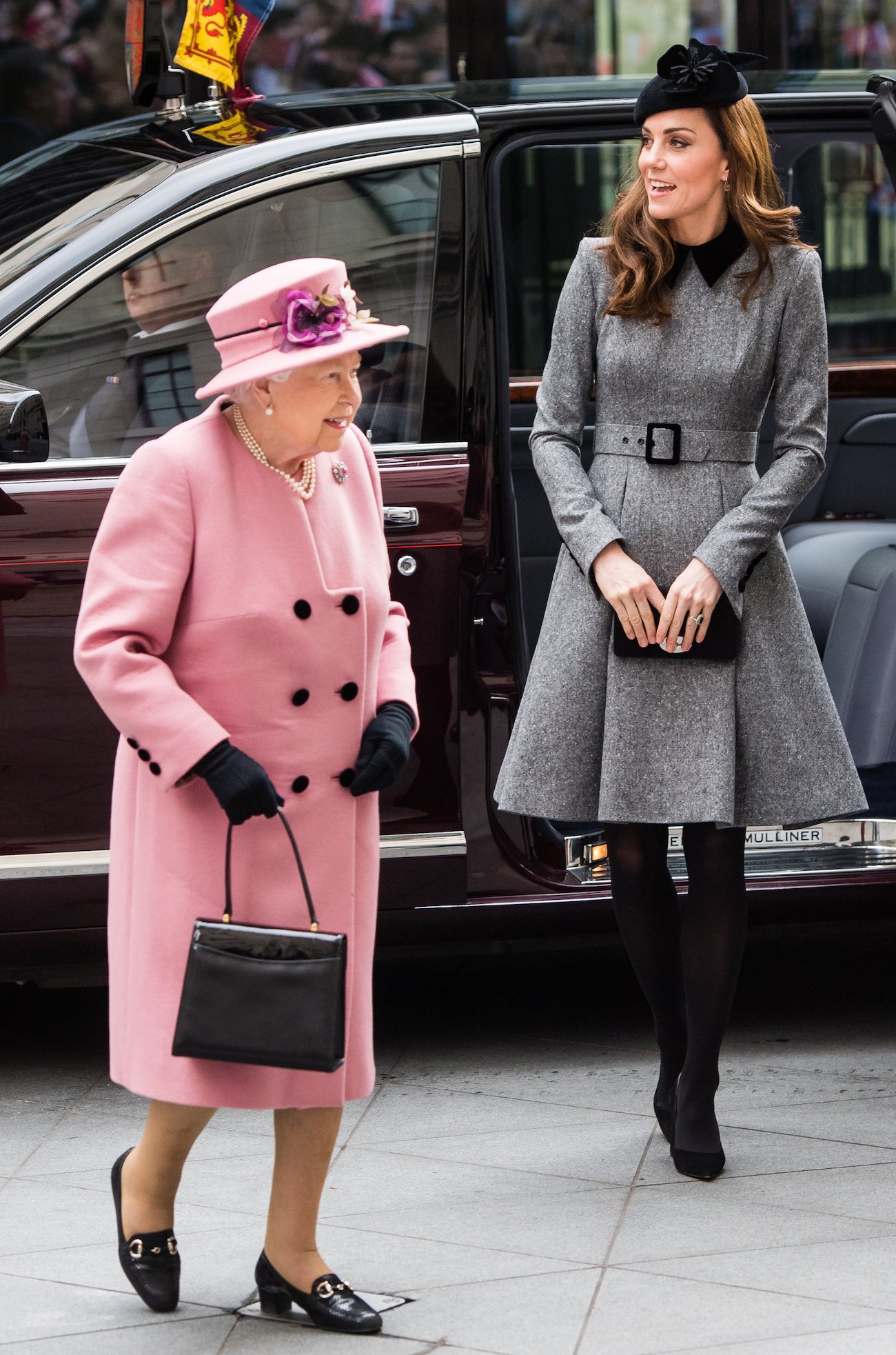 Kate Middleton walks behind Queen Elizabeth II