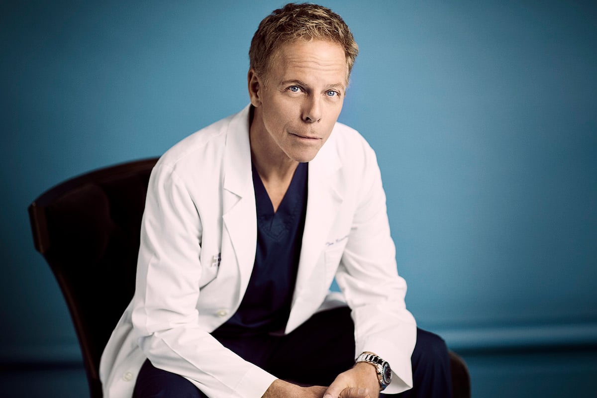 Greg Germann dressed in a white lab coat in 'Grey's Anatomy.'