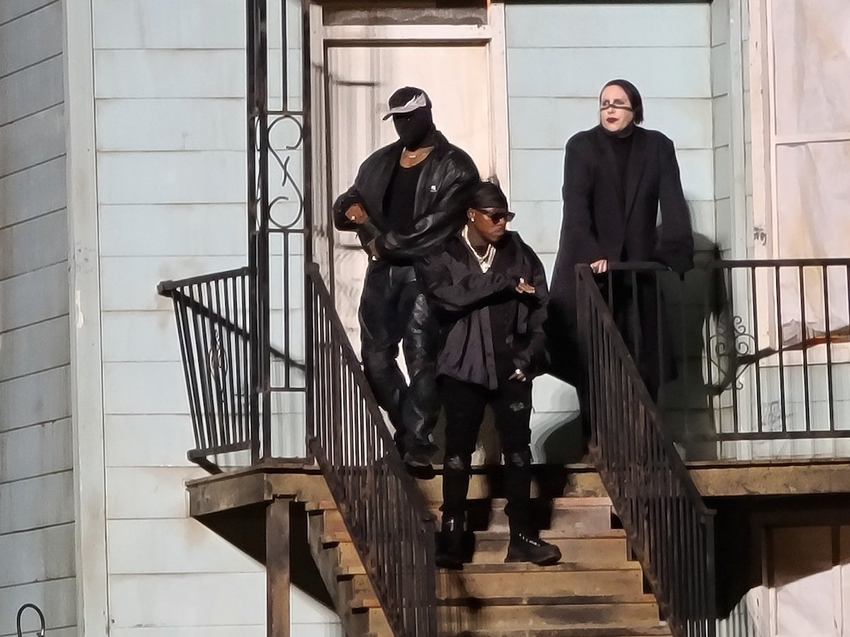 Kanye West, DaBaby, and Marilyn Manson on stage together.