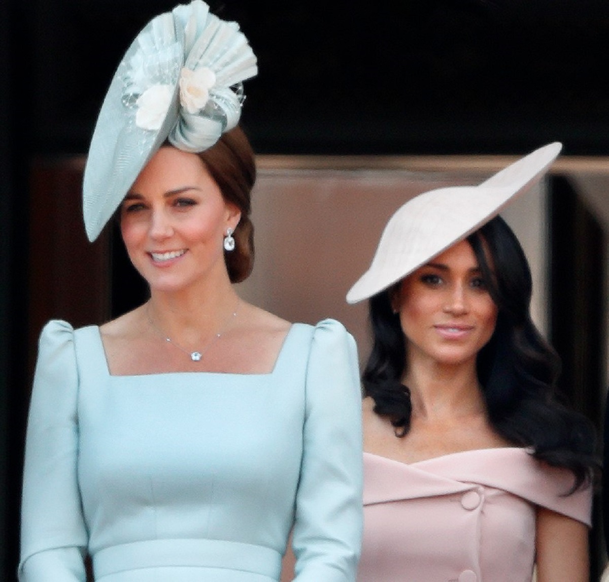 Kate Middleton and Meghan Markle standing together on the balcony of Buckingham Palace during Trooping The Colour 2018