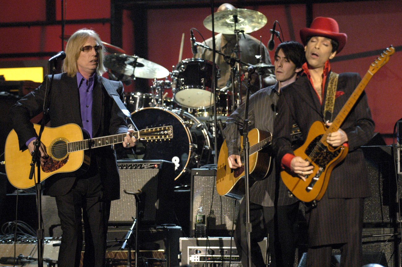 Tom Petty, Dhani Harrison, and Prince performing during George Harrison's Rock & Roll Hall of Fame induction in 2004.