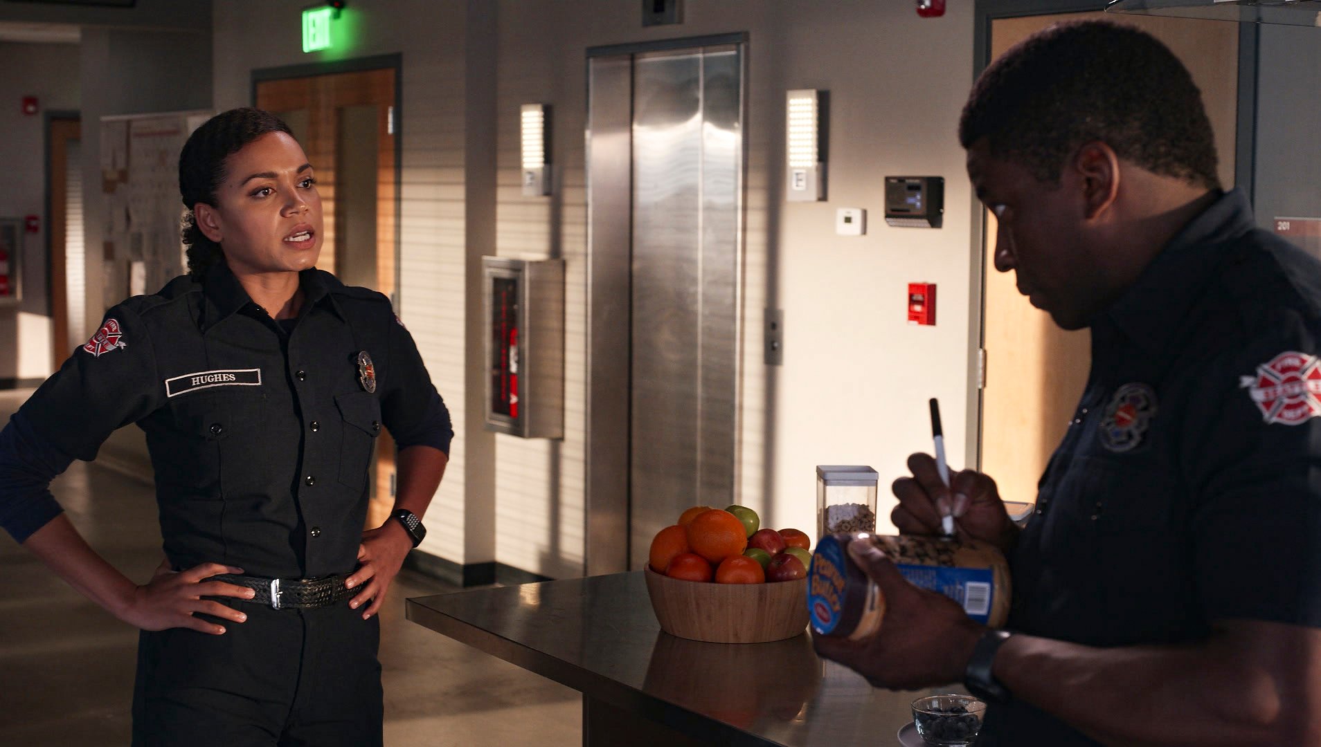 Barrett Doss as Victoria 'Vic' Hughes and Okieriete Onaodowan as Dean Miller share a conversation together in 'Station 19' Season 5 Episode 5, the 'Grey's Anatomy' Season 18 crossover 