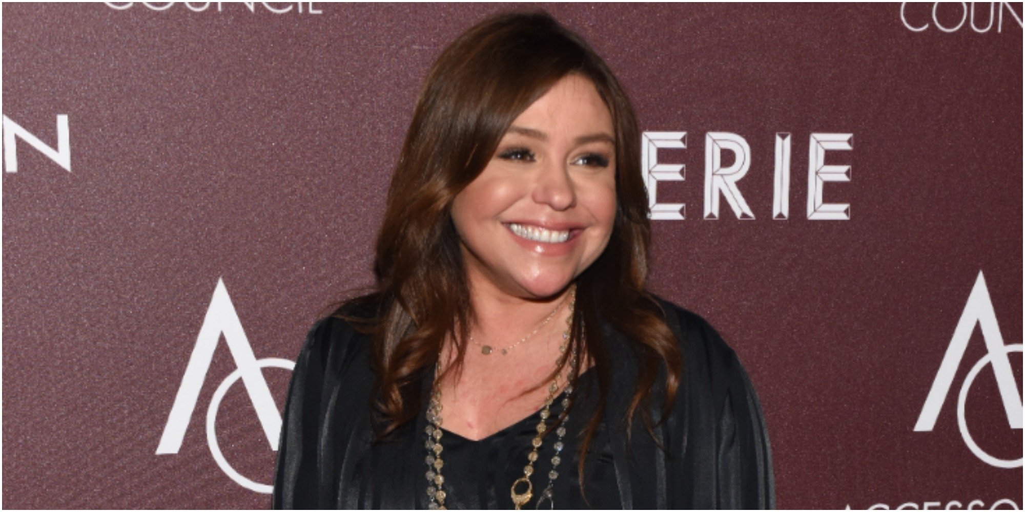 Rachael Ray poses on the red carpet at a celebrity event.