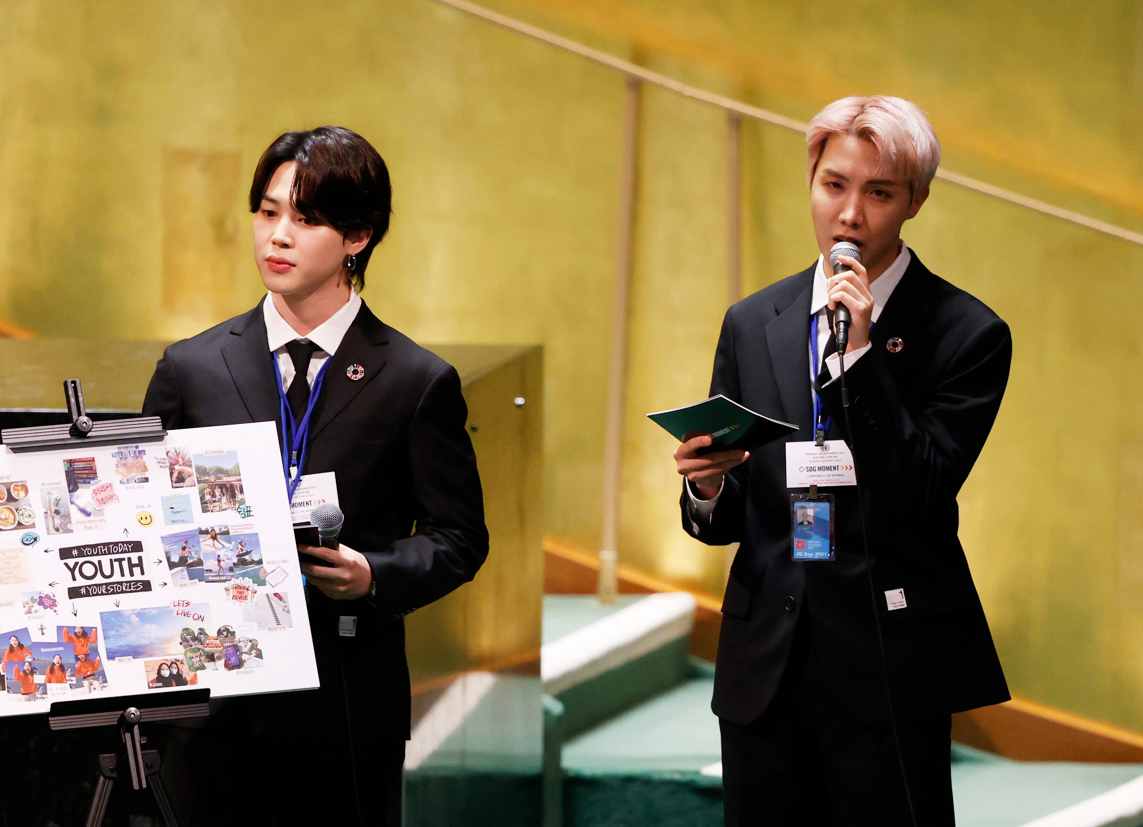 Jimin listens as J-Hope of the boy band BTS speaks at the SDG Moment event as part of the UN General Assembly 76th session General Debate