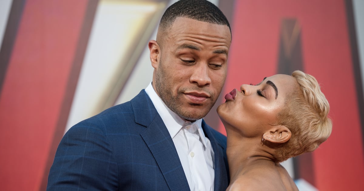 Meagan Good kisses DeVon Franklin on cheek