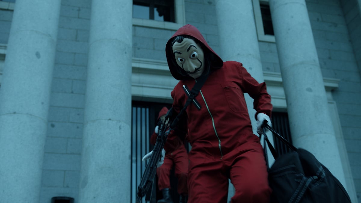 A cast member dressed in a red jumpsuit and Salvador Dalí mask in 'Money Heist.'