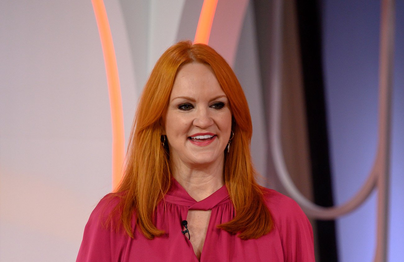 Ree Drummond looks on wearing a pink top