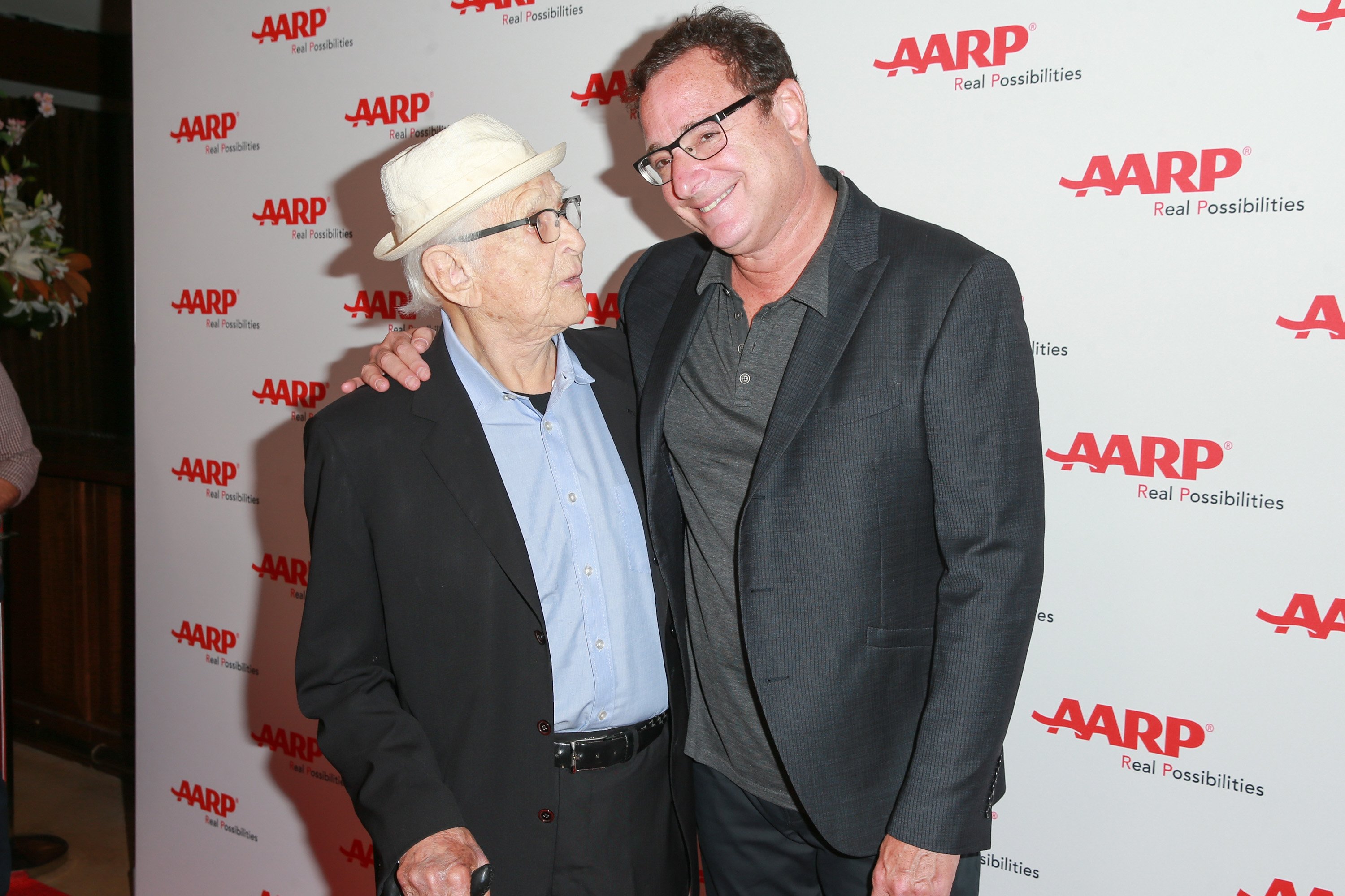Producer Norman Lear and actor Bob Saget pose for a photo at the AARP TV For Grownups Honors event in 2018.