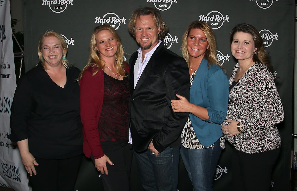 Kody Brown (C) and his wives, (L-R) Janelle Brown, Christine Brown, Meri Brown and Robyn Brown smiling