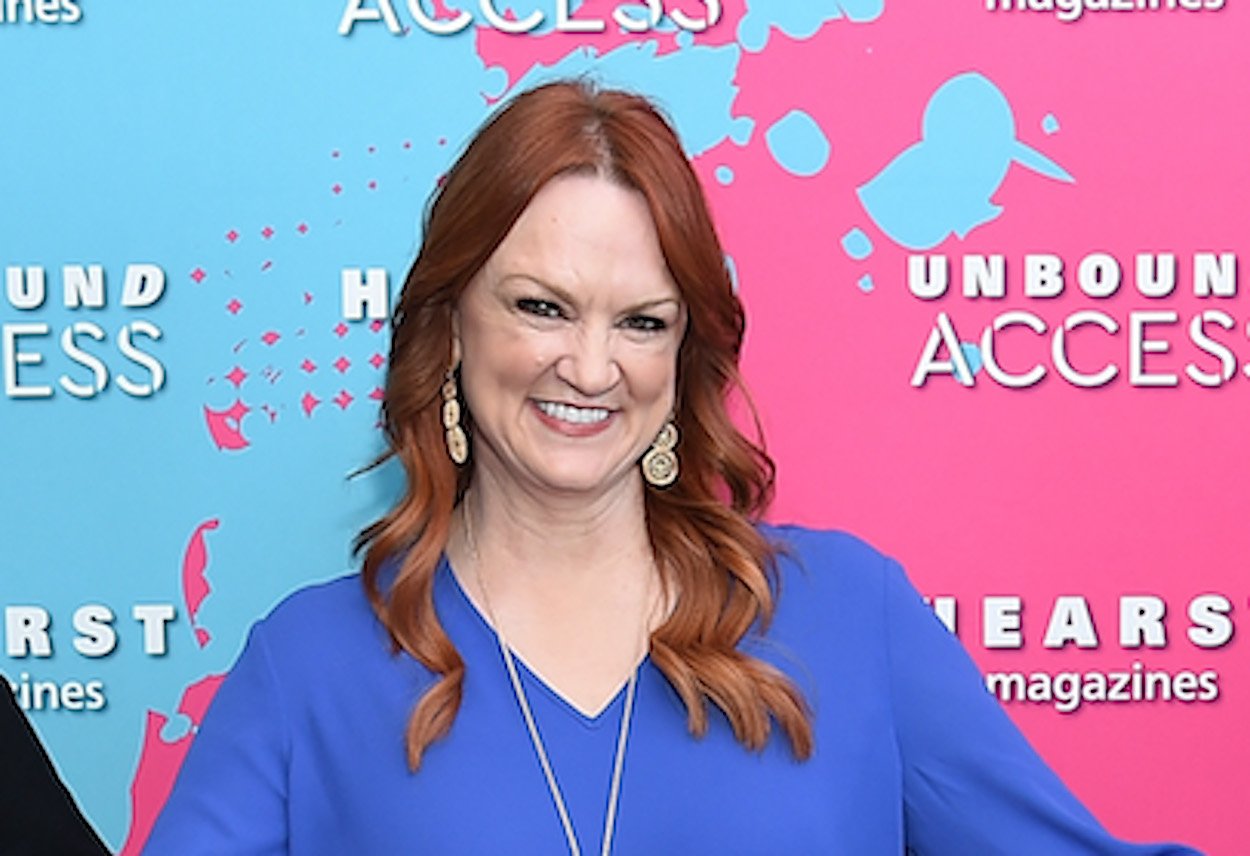 Pioneer Woman Ree Drummond smiles wearing a blue shirt