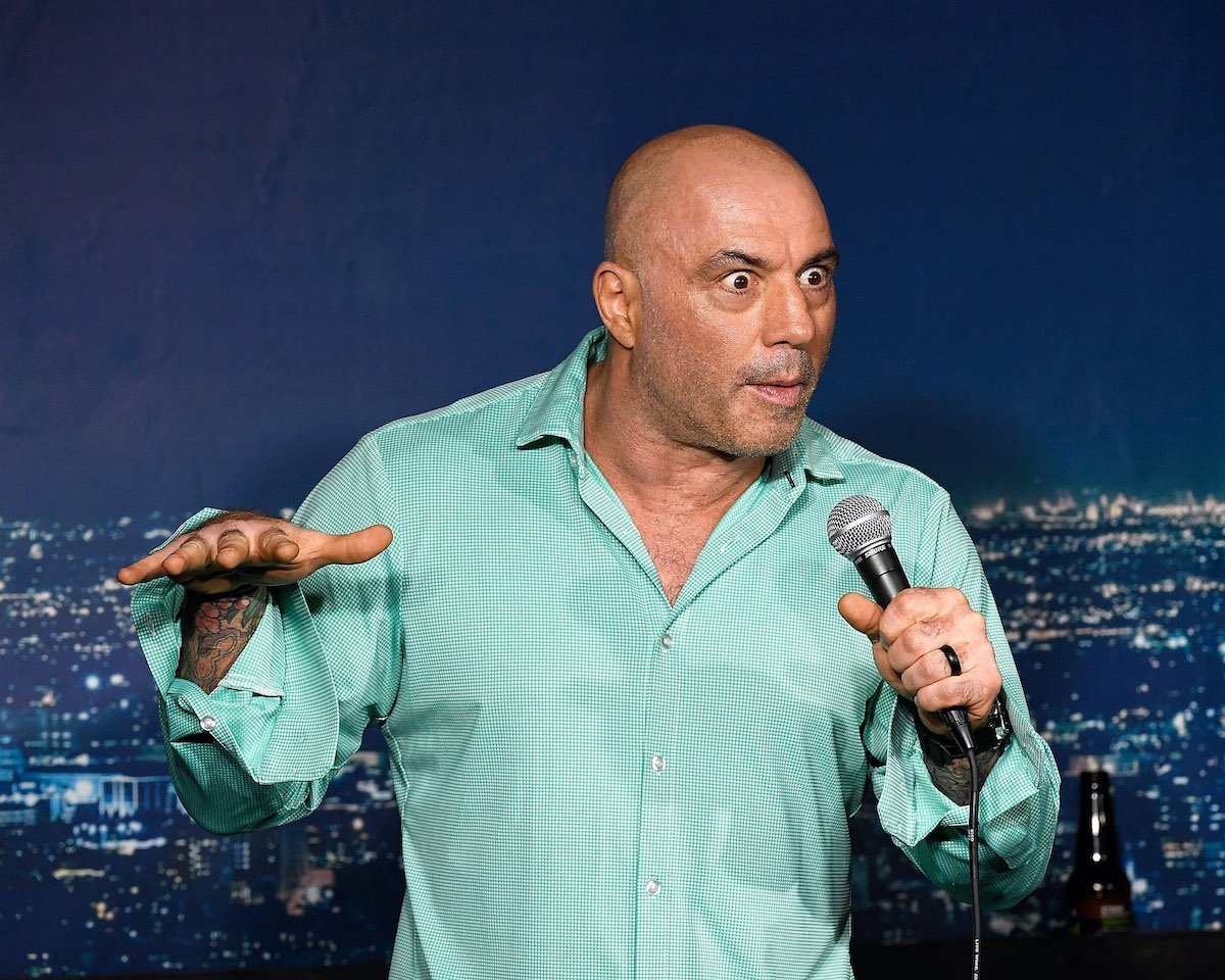 Joe Rogan performing, holding a microphone