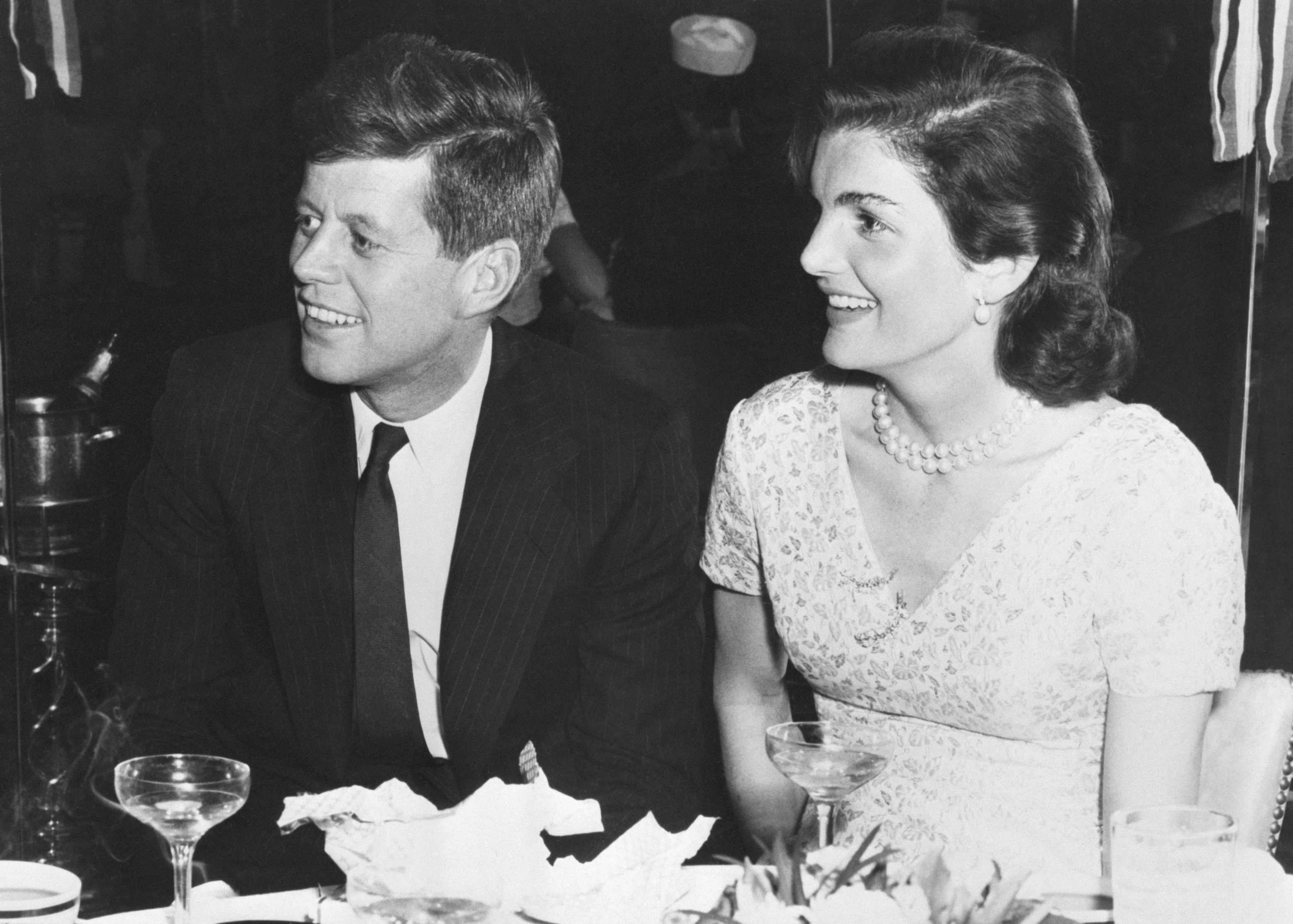 JFK and Jacqueline Kennedy at a table