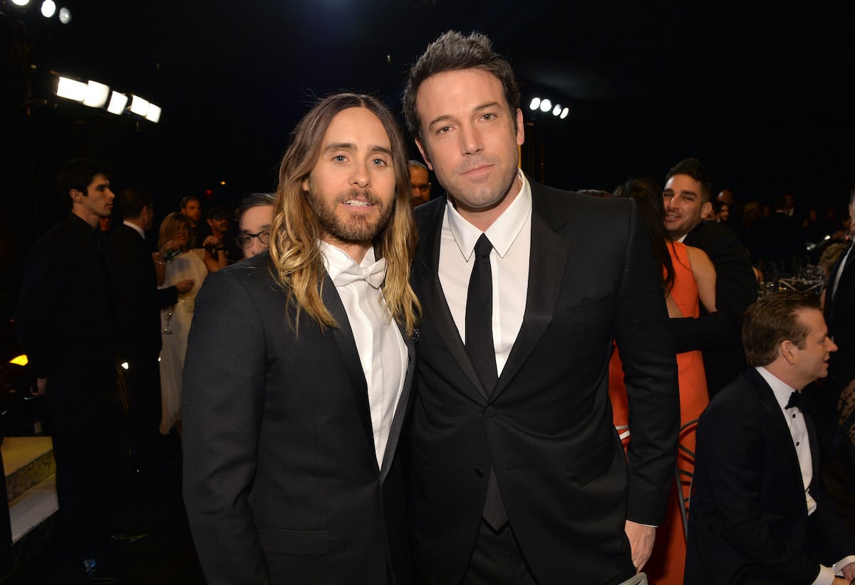 Jared Leto and Batman actor Ben Affleck wear suits and pose at an event