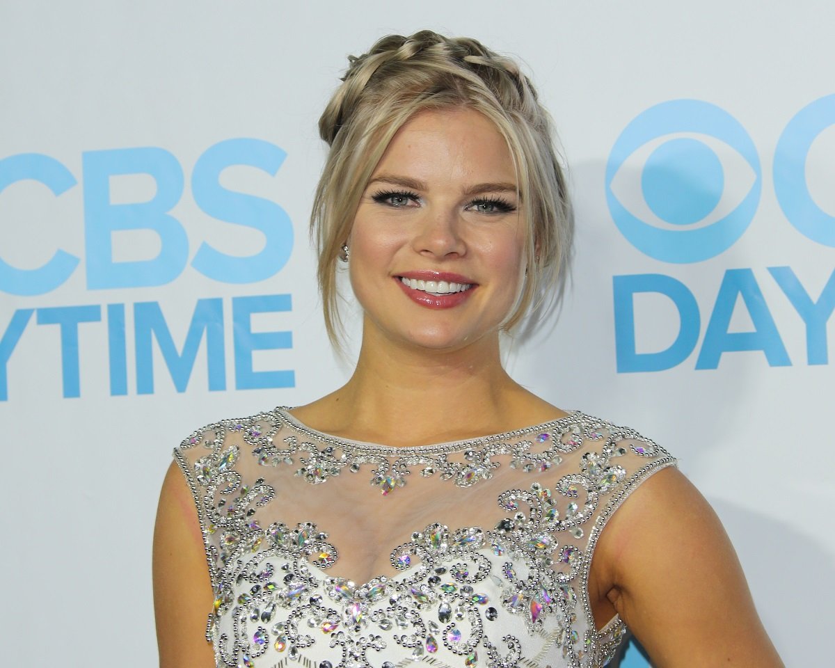 'The Young and the Restless' star Kelli Goss wearing a white sparkly dress during a red carpet appearance.