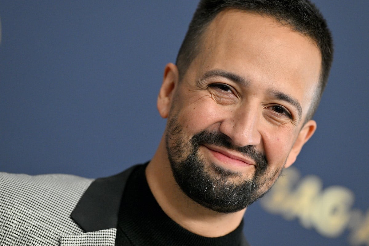 Lin-Manuel Miranda smiles on the red carpet